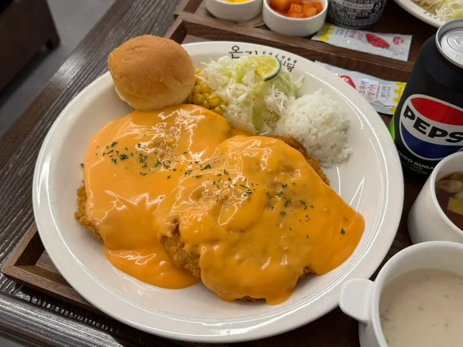 Pork cutlet poured with cheddar cheese sauce