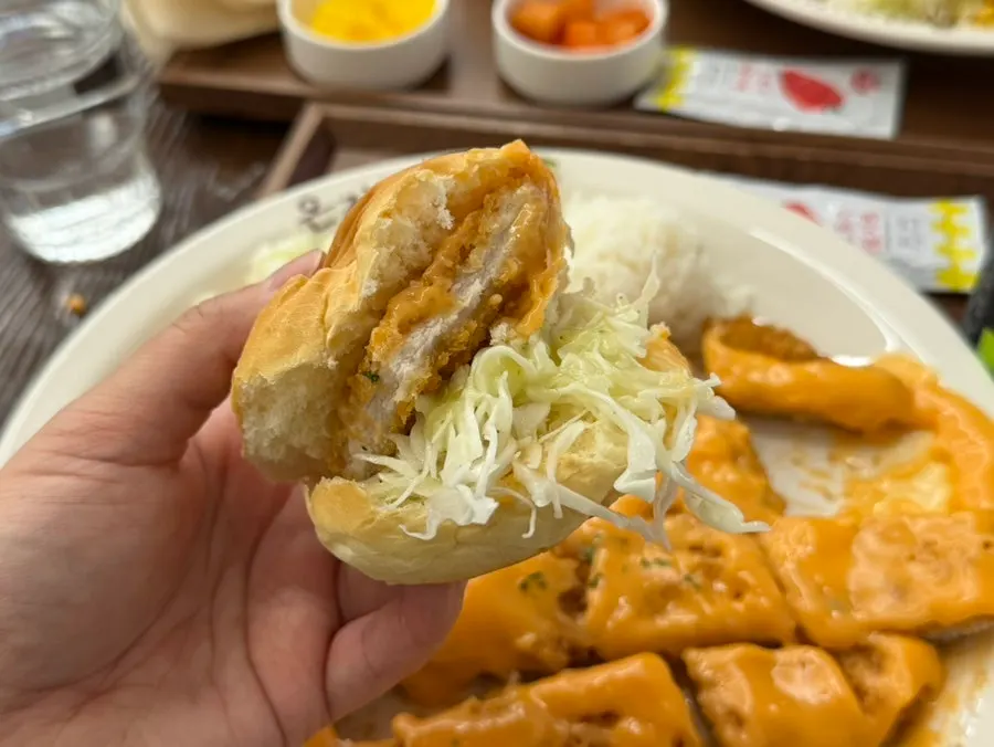 Morning bread roll filled with cutlet and salad