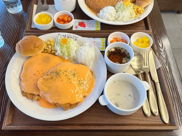 Cross-section of the gyeongyangsik pork cutlet, still crispy under the sauce