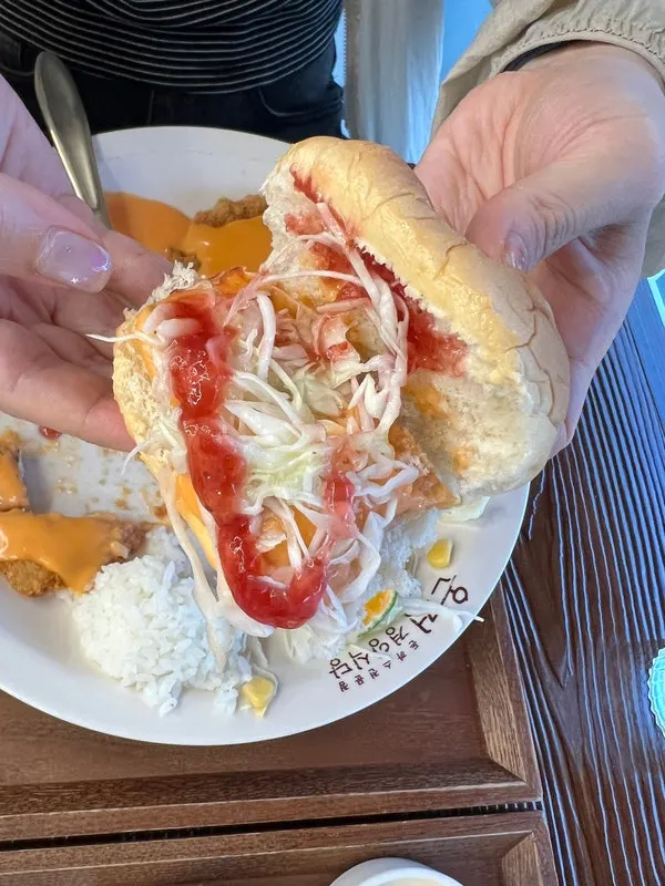 Pork cutlet burger made by stuffing morning bread with cheese cutlet