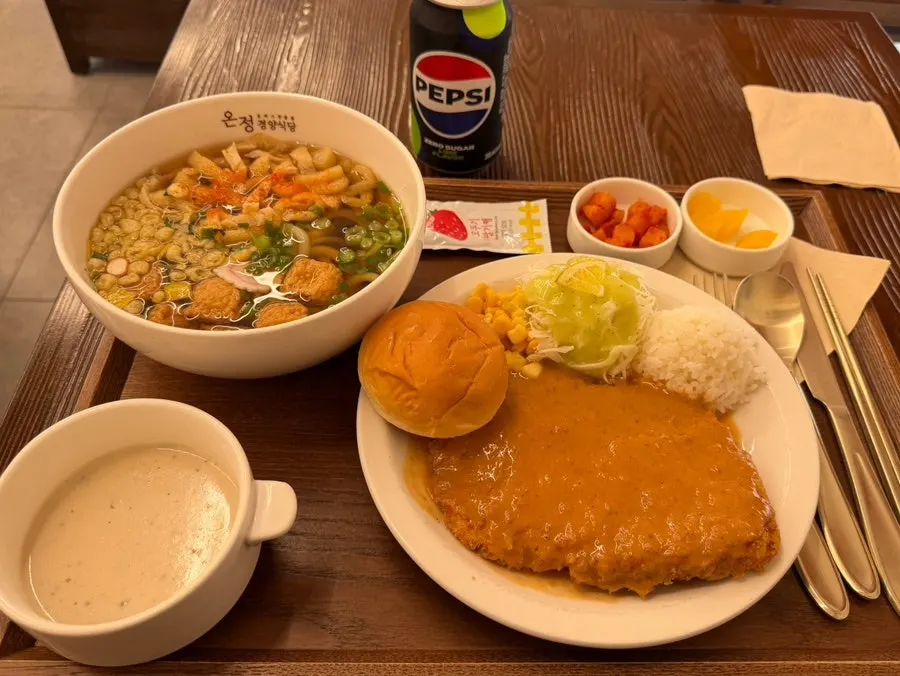 Full spread with pork cutlet, udon, soup and morning bread