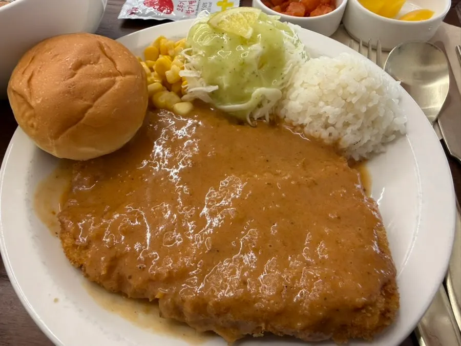 Thin gyeongyangsik pork cutlet with sauce spread over it