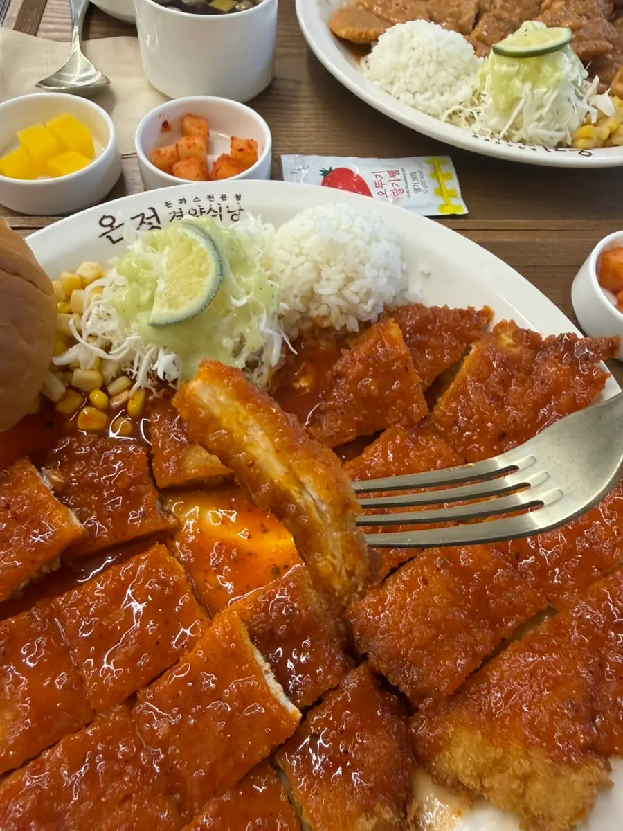 A piece of the spicy pork cutlet picked up