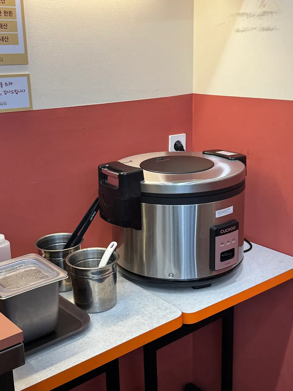Self bar where you can help yourself to rice and side dishes