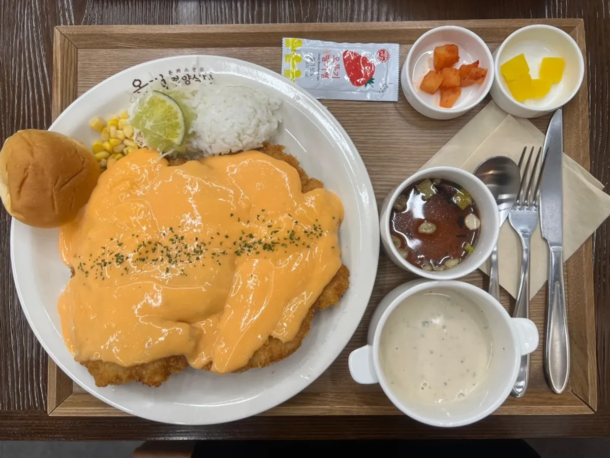 Cheddar cheese donkatsu individual tray setting on a wood tray