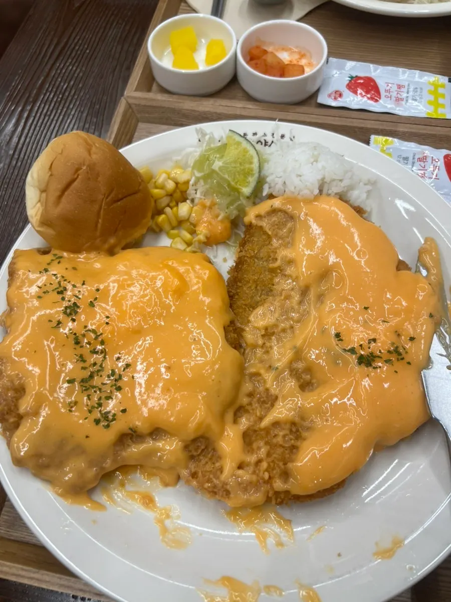Thick pork cutlet topped with cheddar cheese sauce
