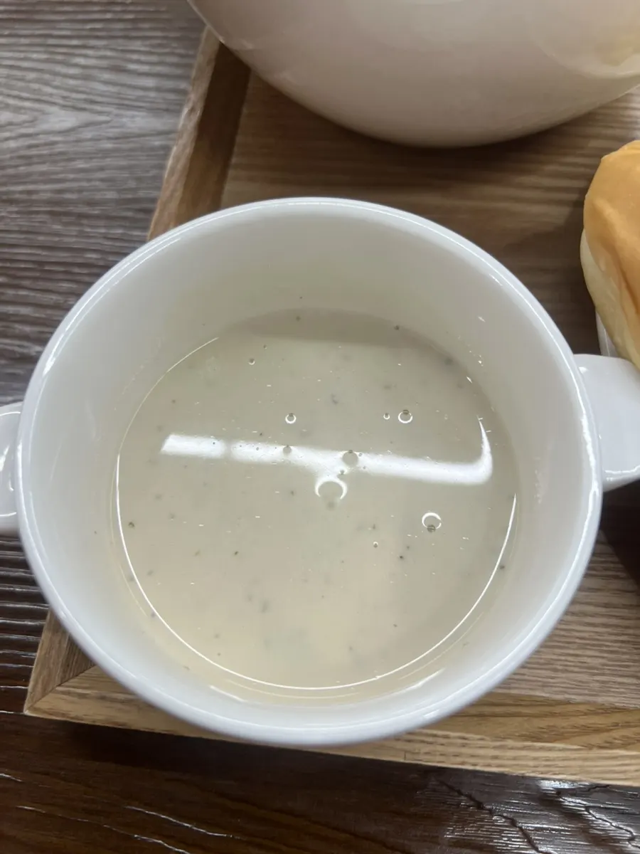 A bowl of cream soup served before the meal