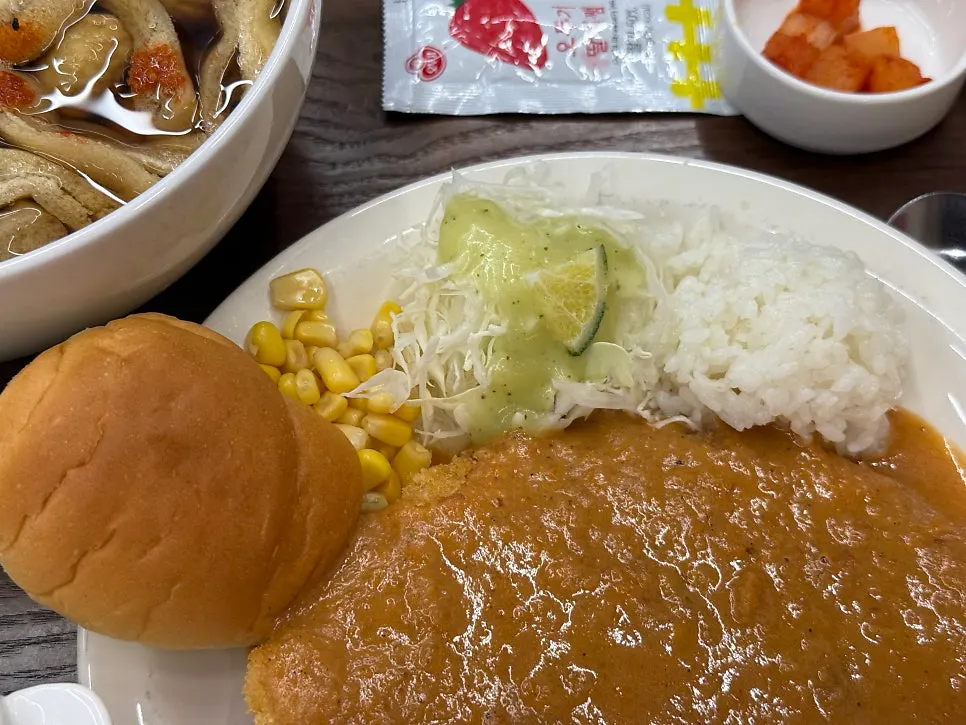Warm soup served alongside the pork cutlet