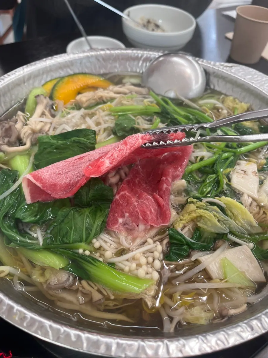 Table spread with beef and shabu vegetables