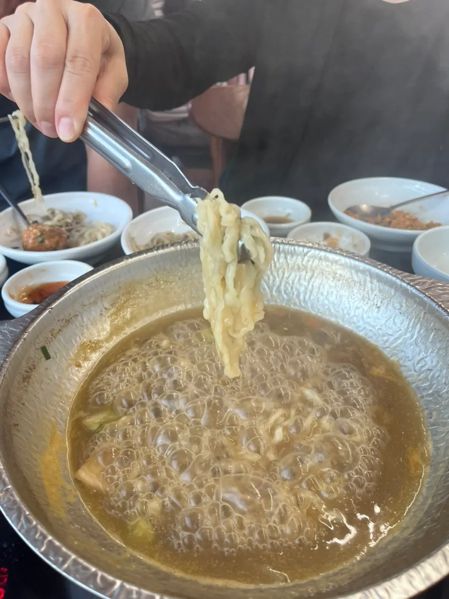 Beef cooking in the boiling broth