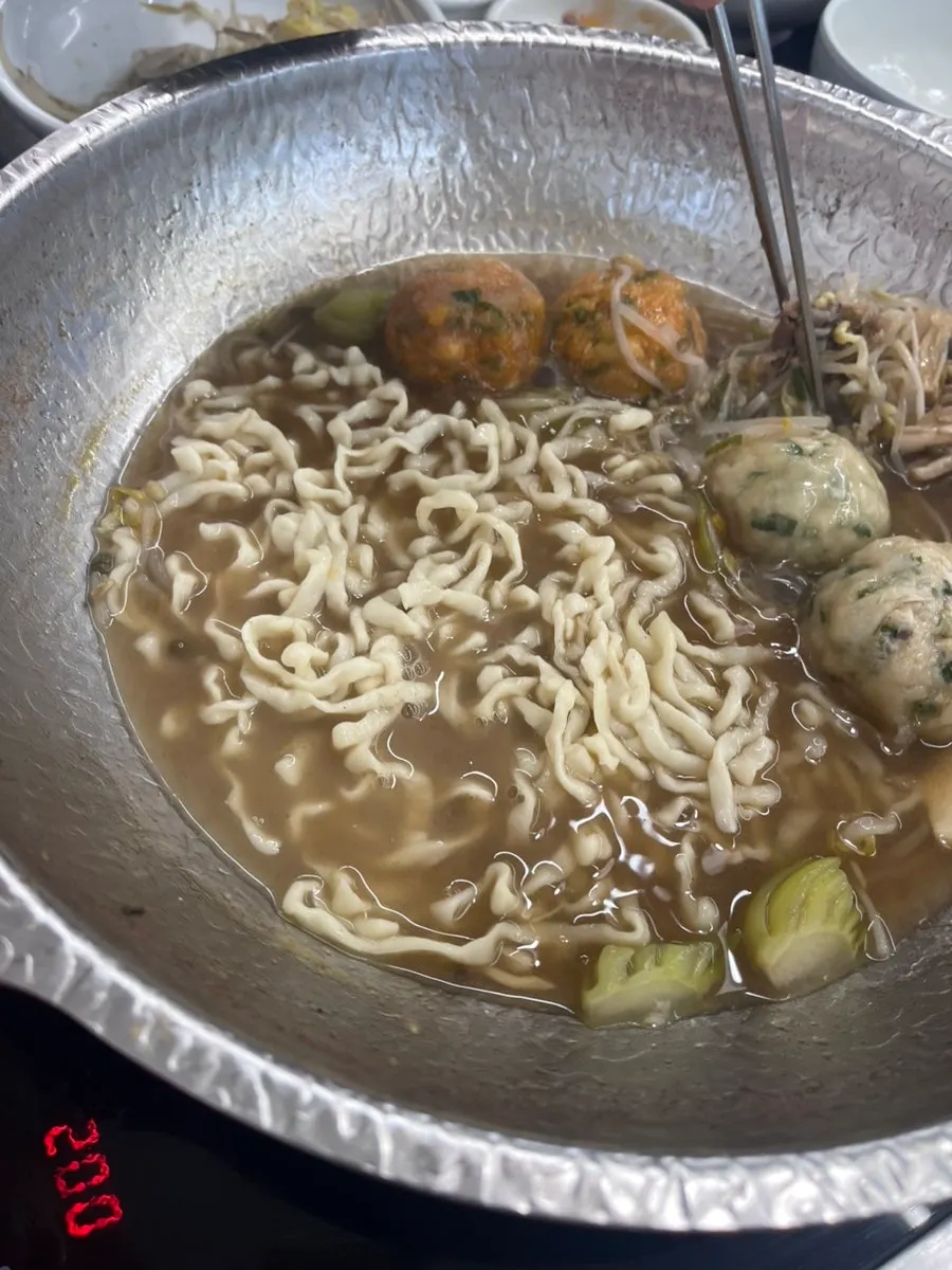 Kalguksu noodles added to the remaining broth