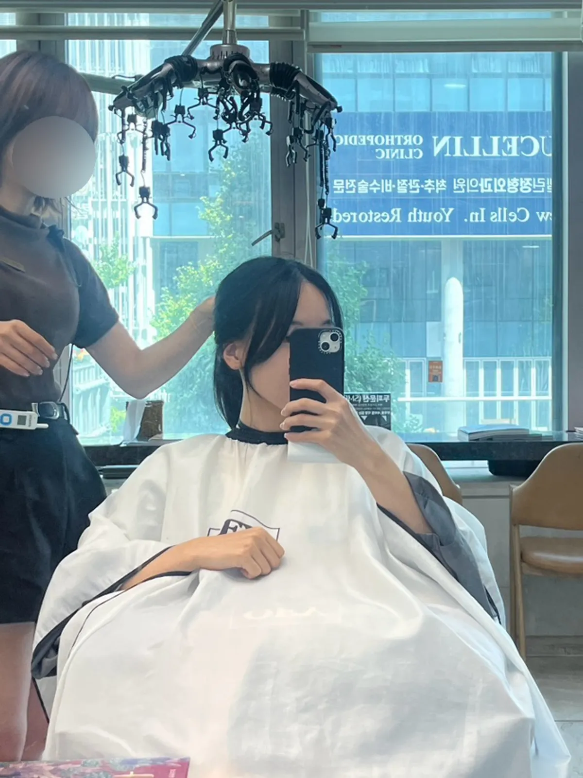 Bangs cut being done to match face shape