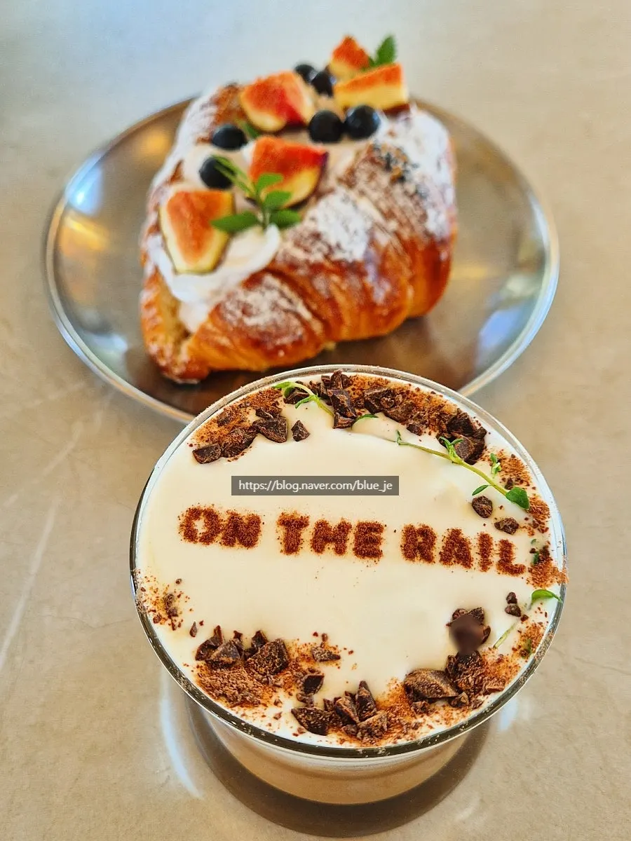 On the Rail's cream mocha and fig croissant order set on the table