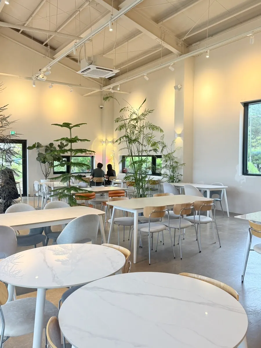 On the Rail's indoor seating with white-toned tables