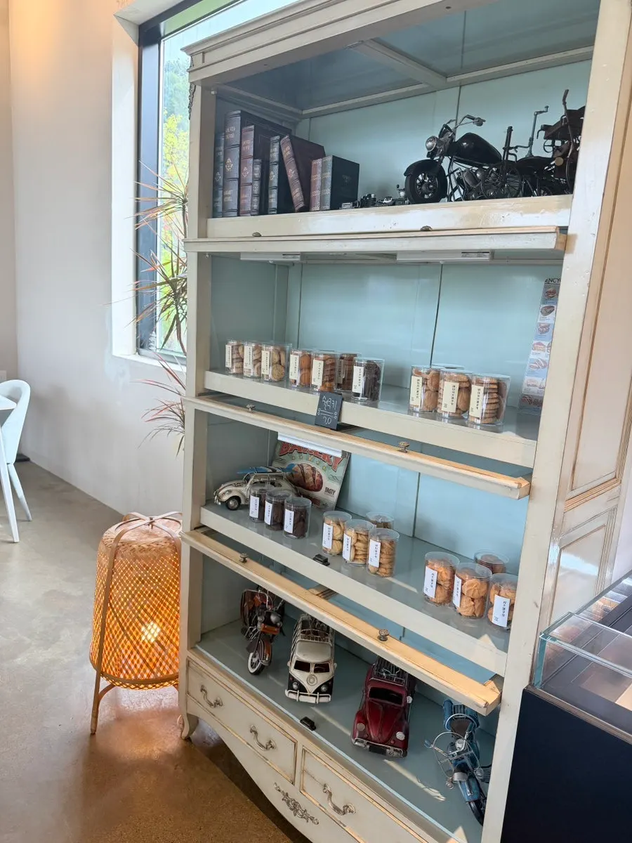 Café interior decorated with classic car and motorcycle pieces