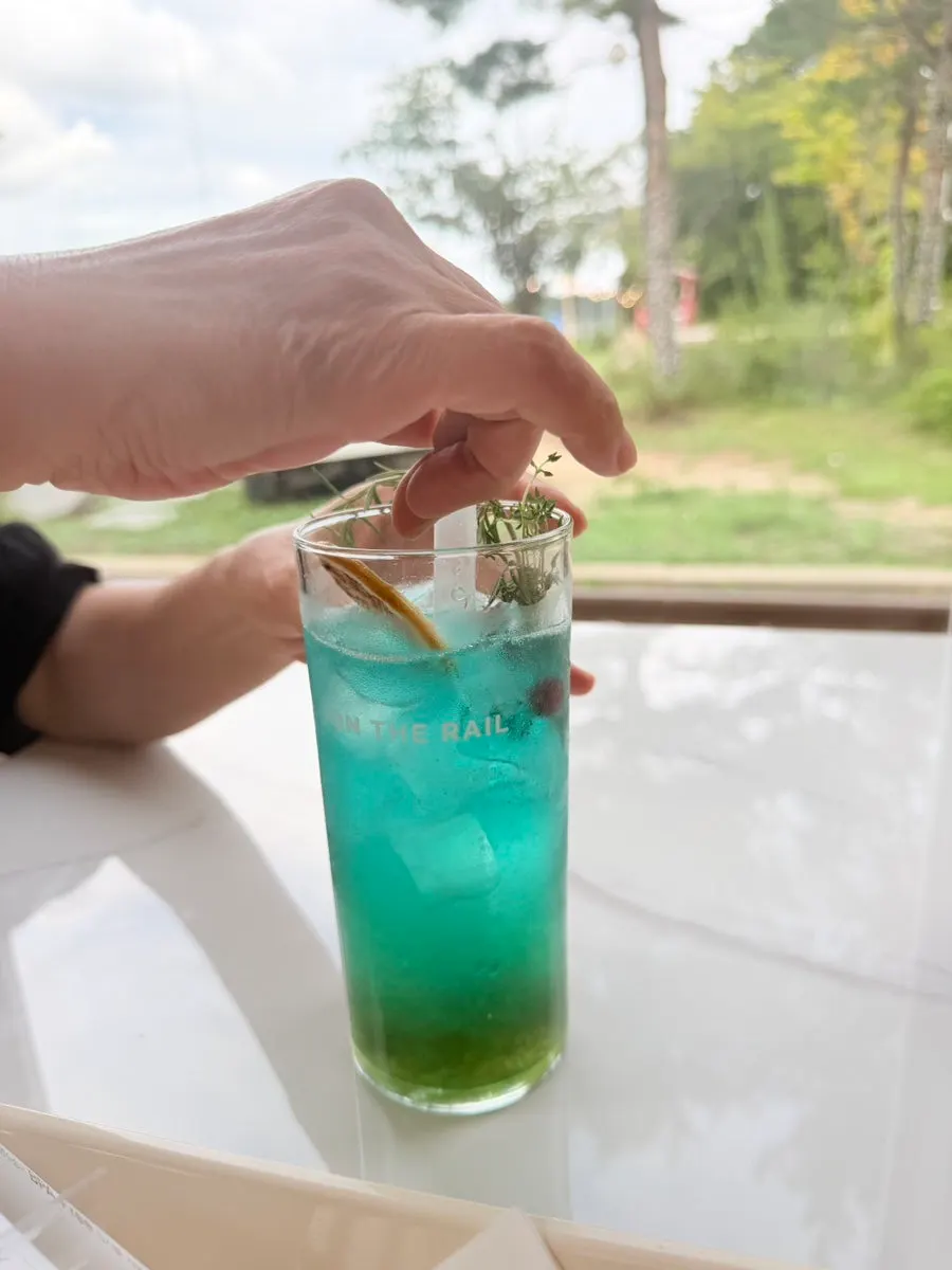 Three drinks from On the Rail placed on the table