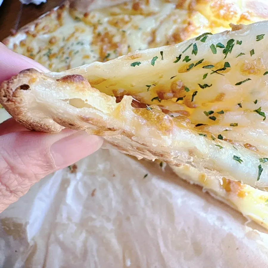 Pink radish pickle served alongside the gorgonzola pizza