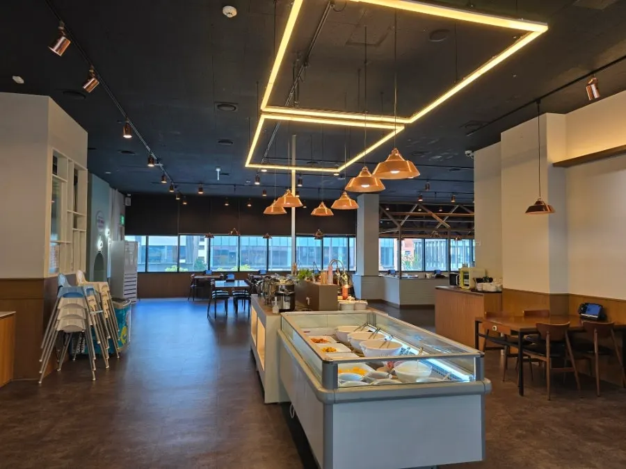 Interior of Opus240's dining hall with widely spaced tables