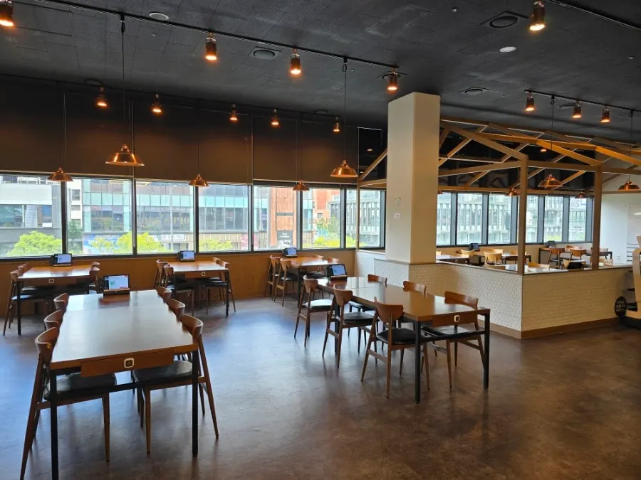 Seating by the floor-to-ceiling windows at Opus240