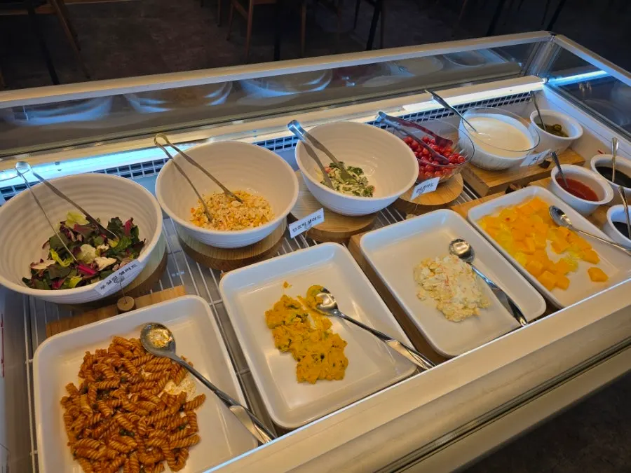 Unlimited-refill salad bar corner at Opus240