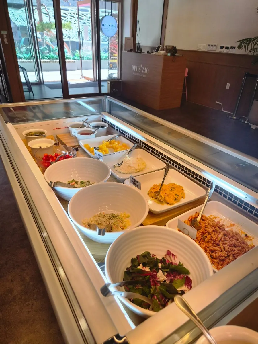 Salad bar located at the center of the restaurant