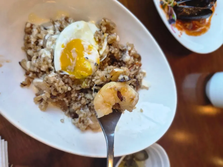 Shrimp pilaf topped with a fried egg
