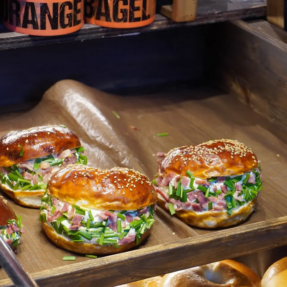 Display shot of chubby, filling-stuffed sand bagels