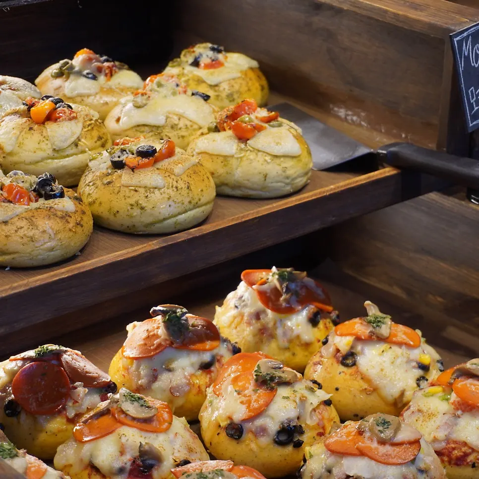 Bagel display case partly sold out in the afternoon
