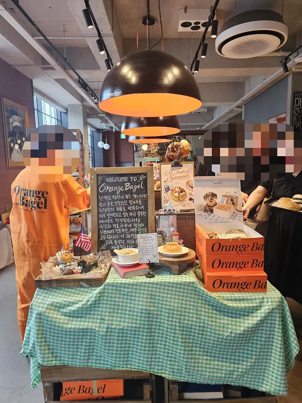 Red and orange themed concept space at Orange Bagel