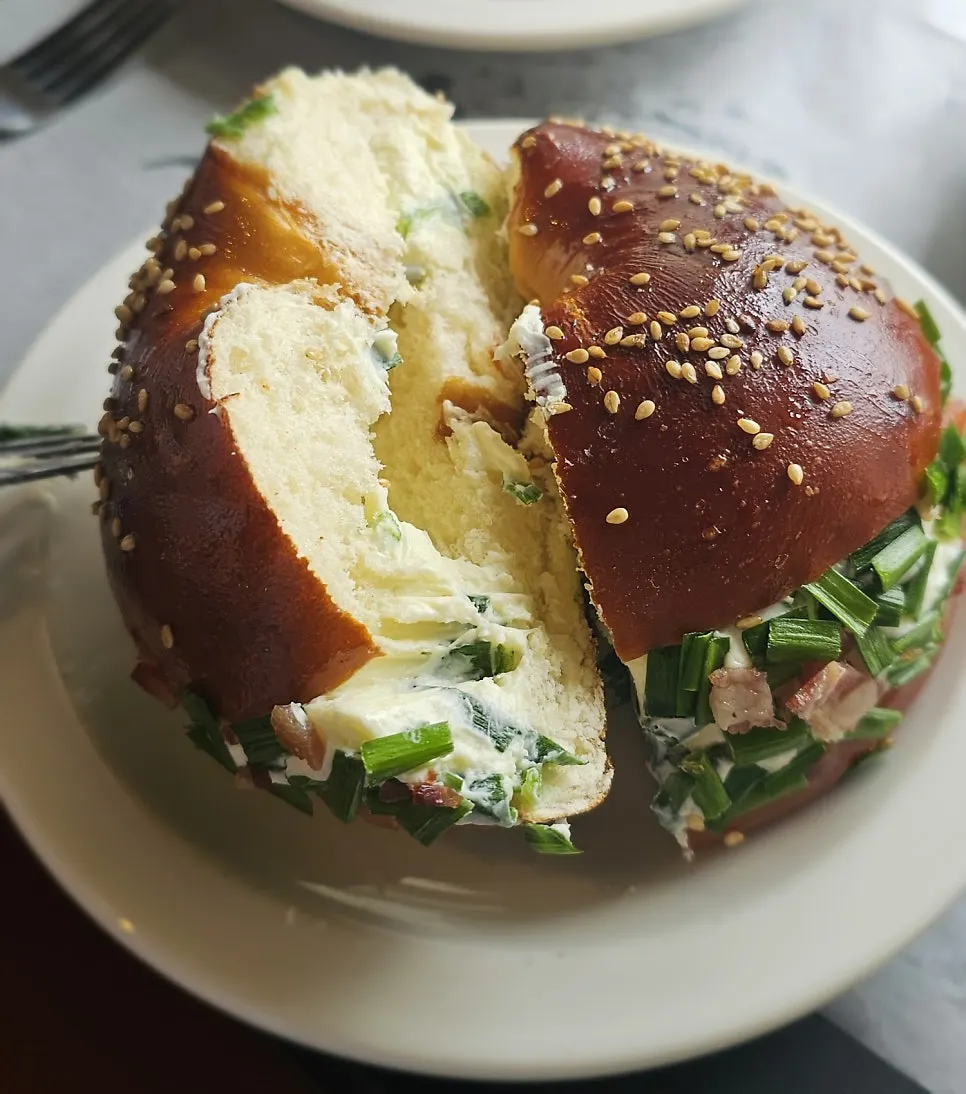 Scallion cream bacon bagel at Orange Bagel