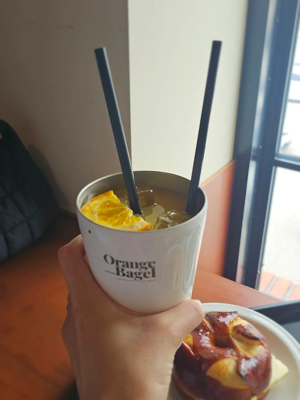 A glass of orange juice at Orange Bagel