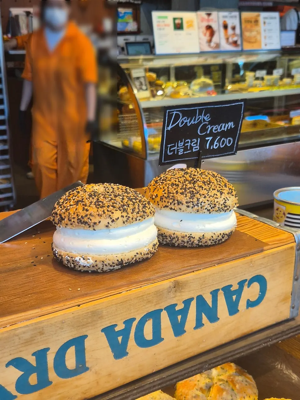 Bagels displayed on the shelf at Orange Bagel