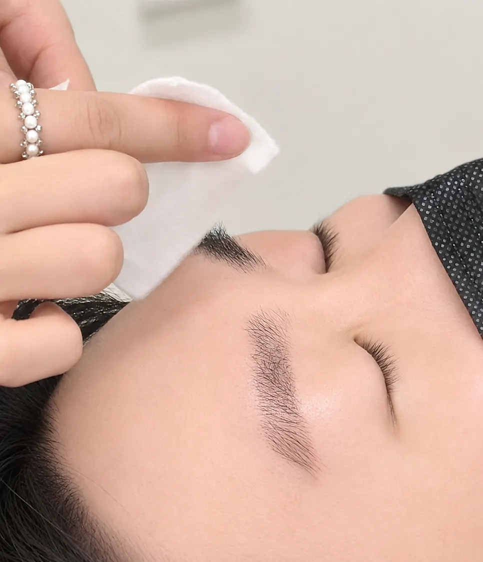 Tidying the skin texture around the eyebrow area before the procedure