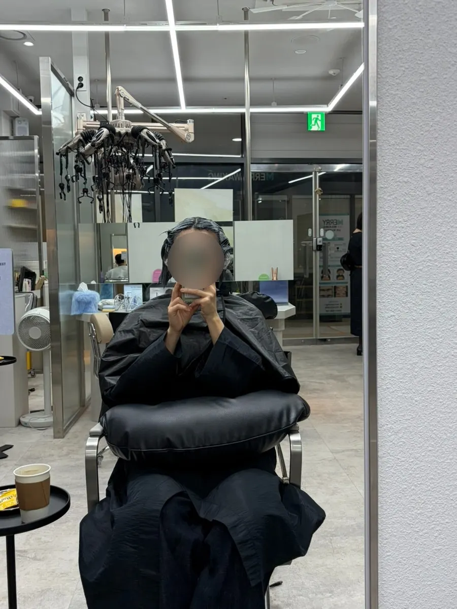 Designer personally applying the dye
