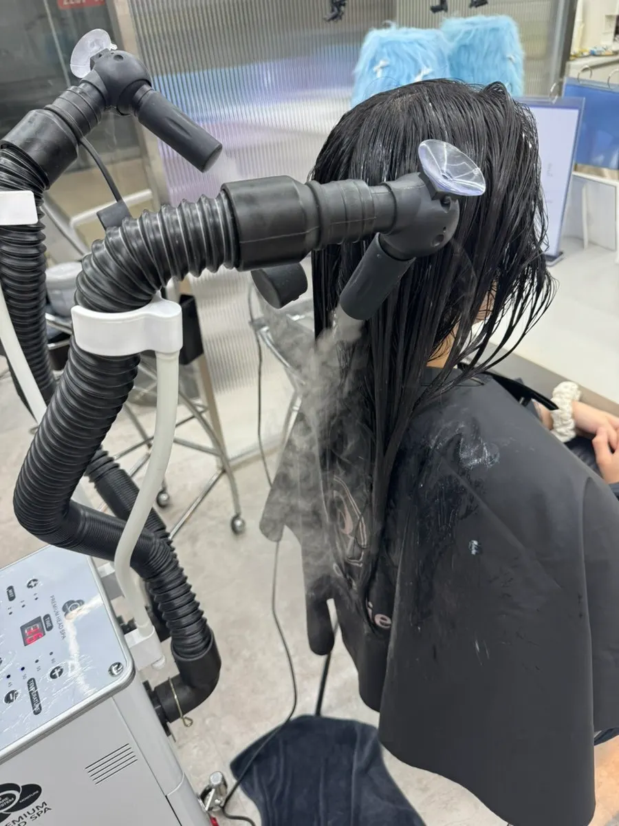 Applying clinic product to the entire hair