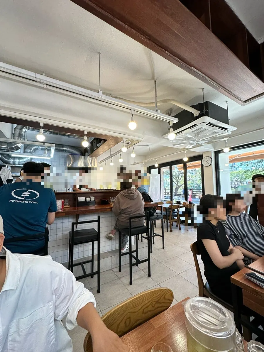 Bright wood interior seating at Oreno Ramen Eunpyeong