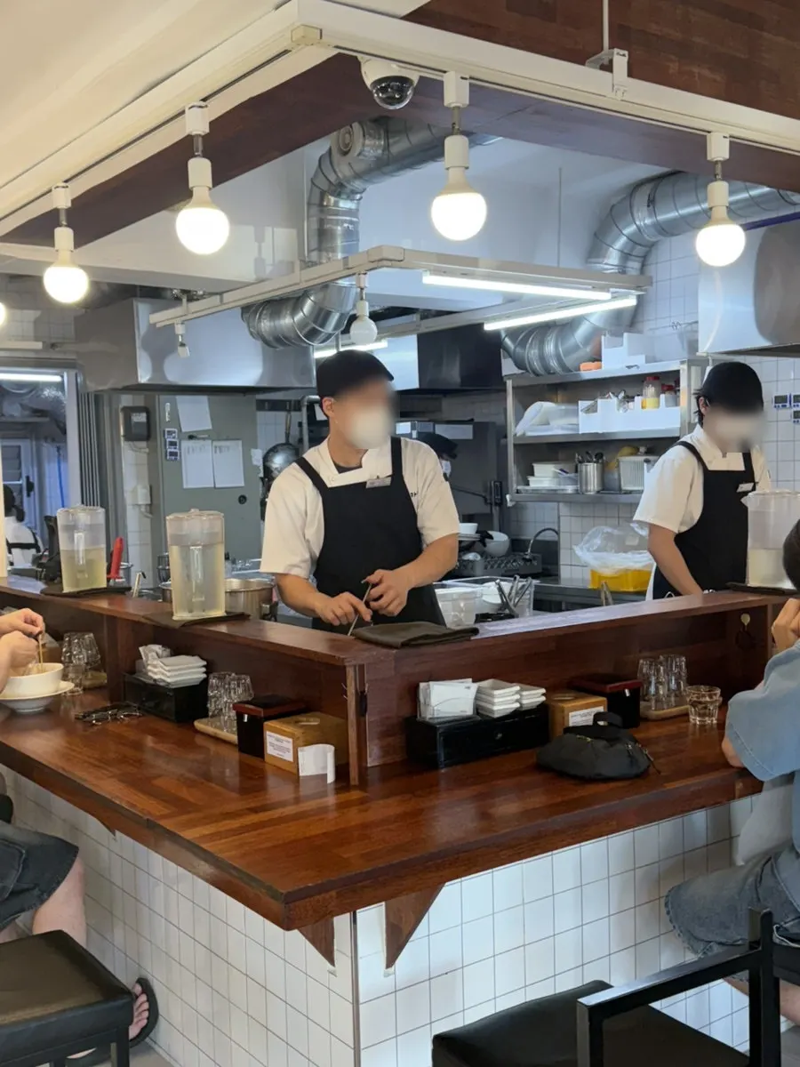 Interior with solo bar seats and table seating