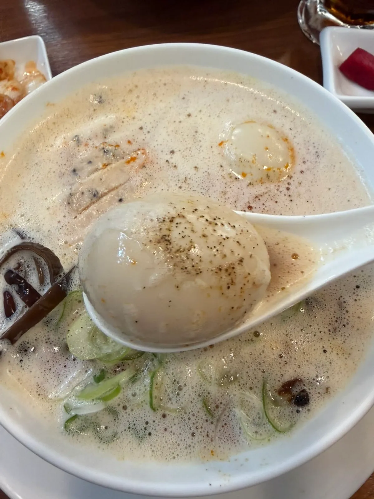 Karai paitan ramen topped with two soft-boiled eggs