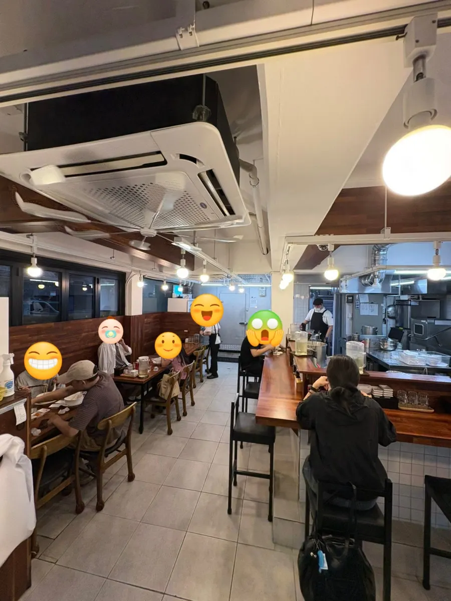 Interior with bar table and a 4-person table