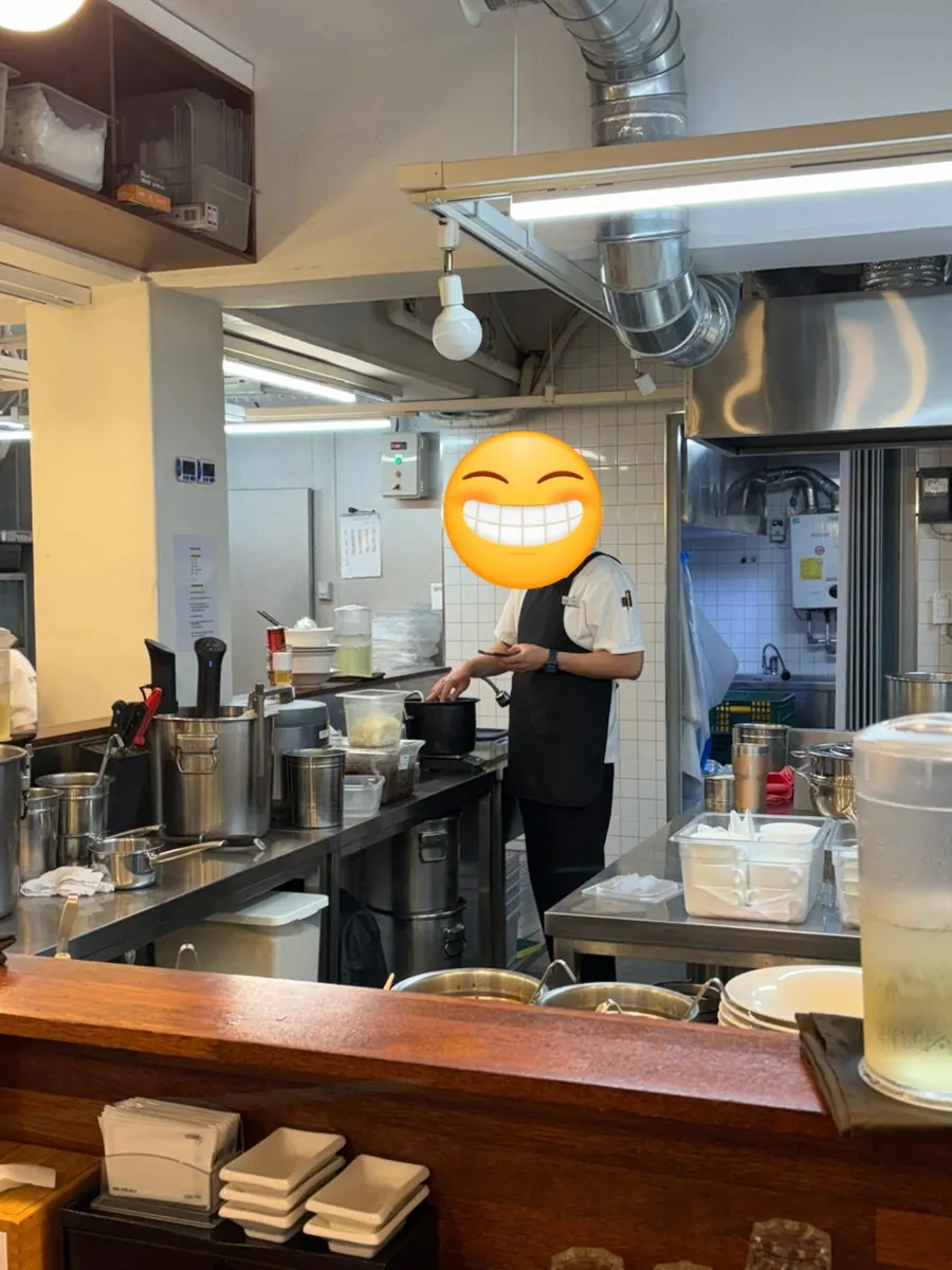 Bar seats facing the open kitchen