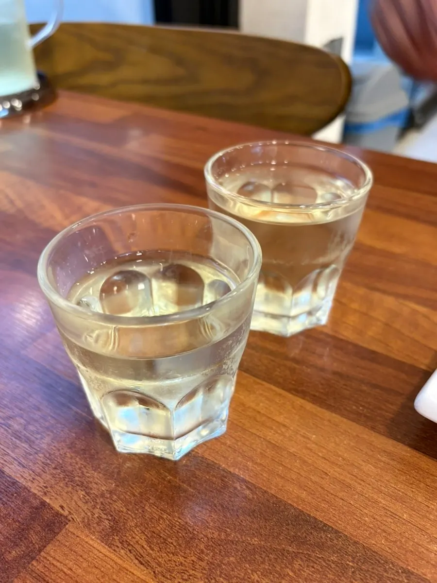 Cup of water with a green-tea-like toasty flavor