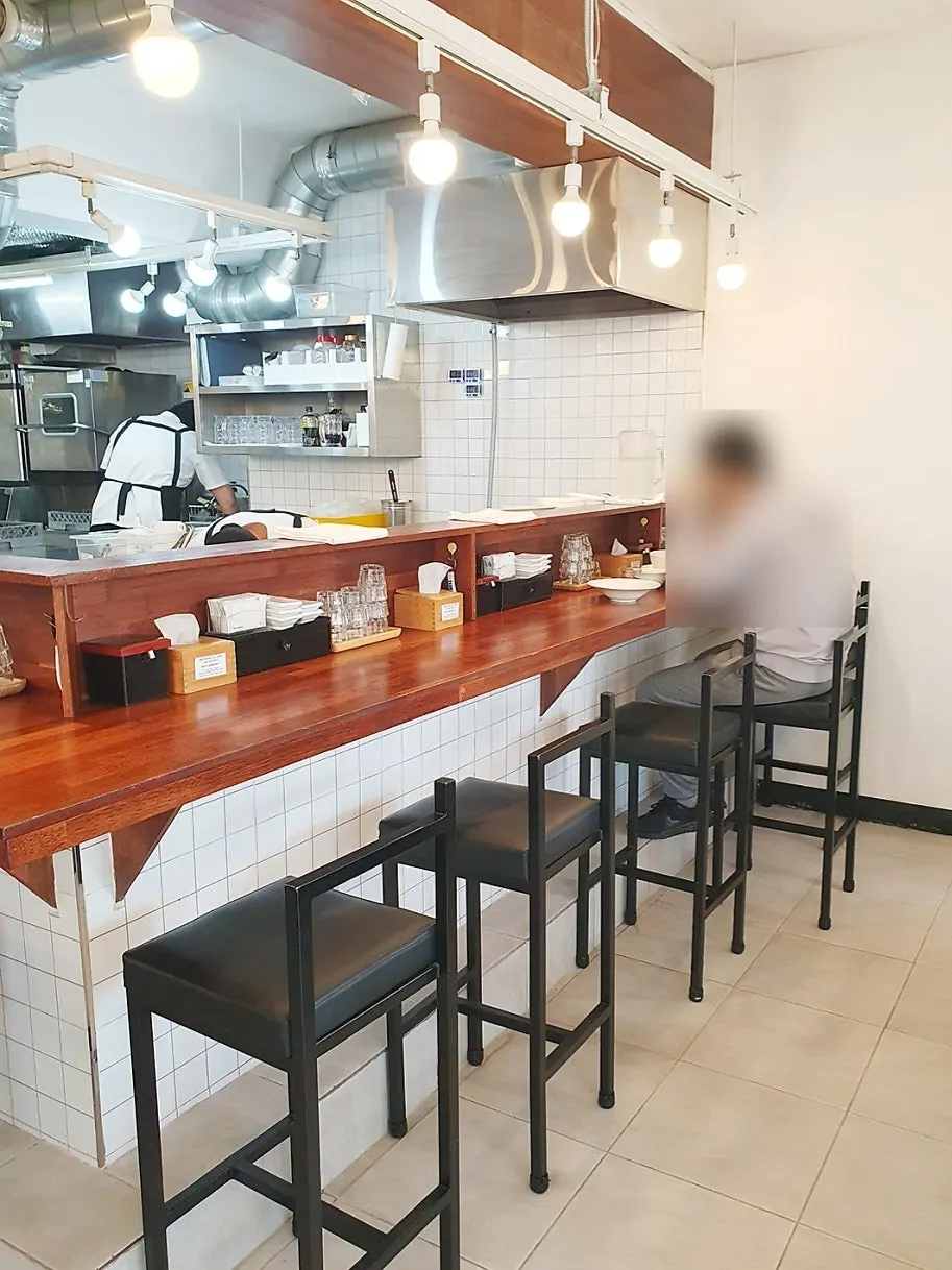 Interior tables at Oreno Ramen Eunpyeong