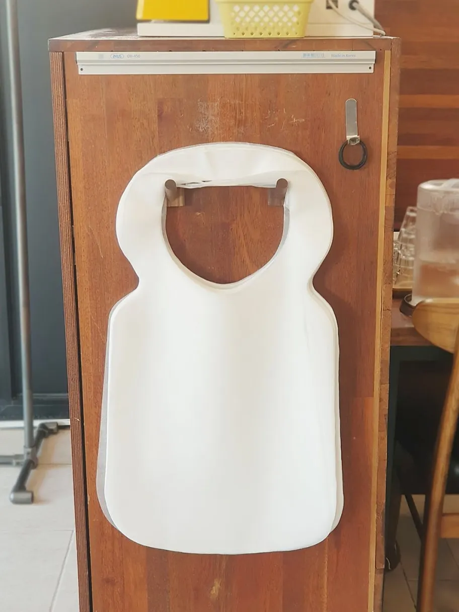 Disposable aprons set out at the entrance
