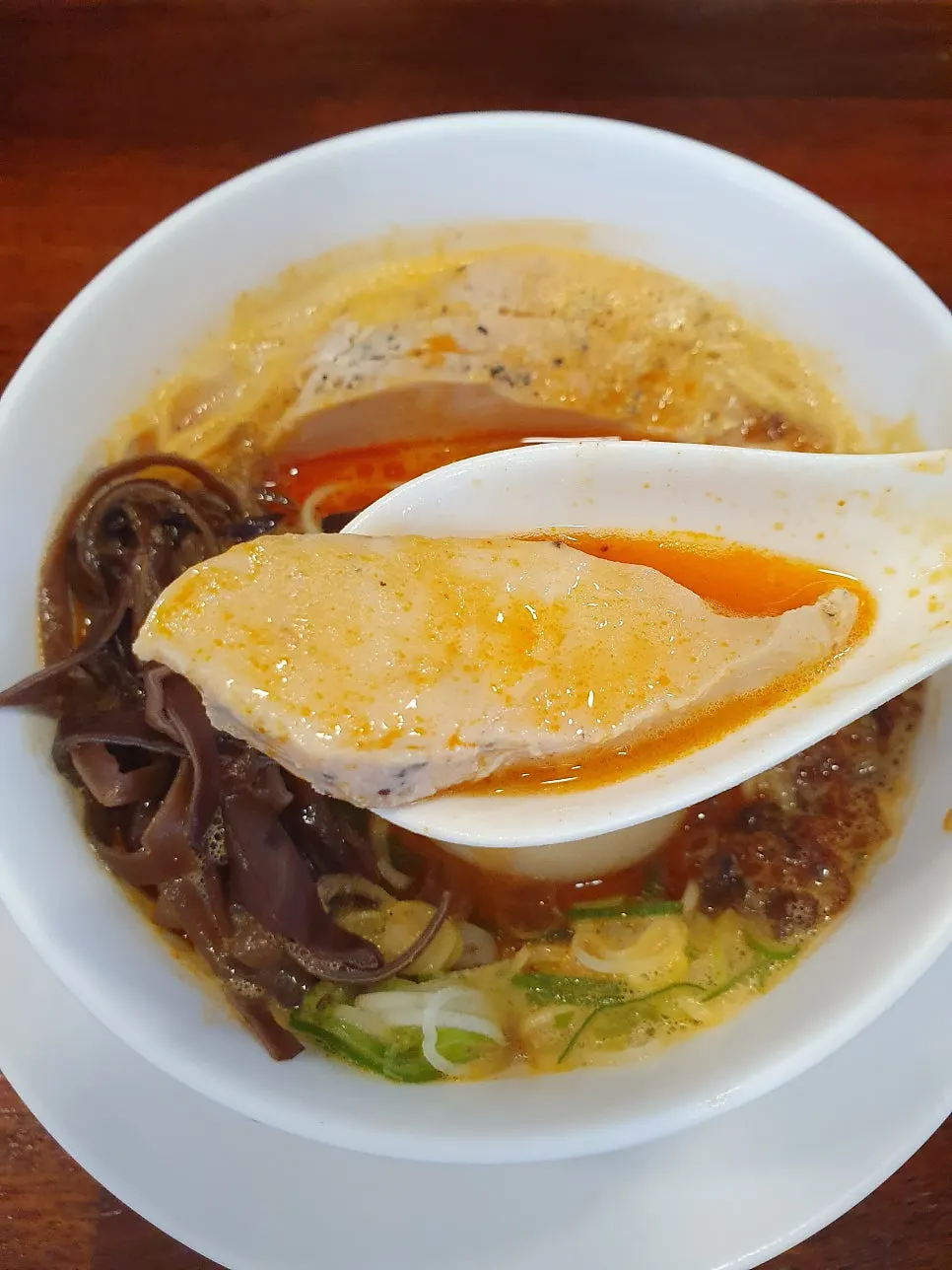 A whole onsen tamago cut in half, cross-section