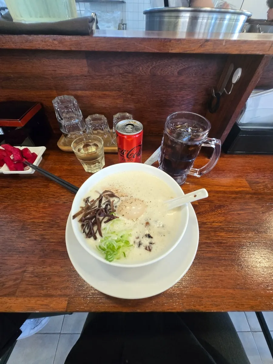 Ramen broth sprinkled with pepper