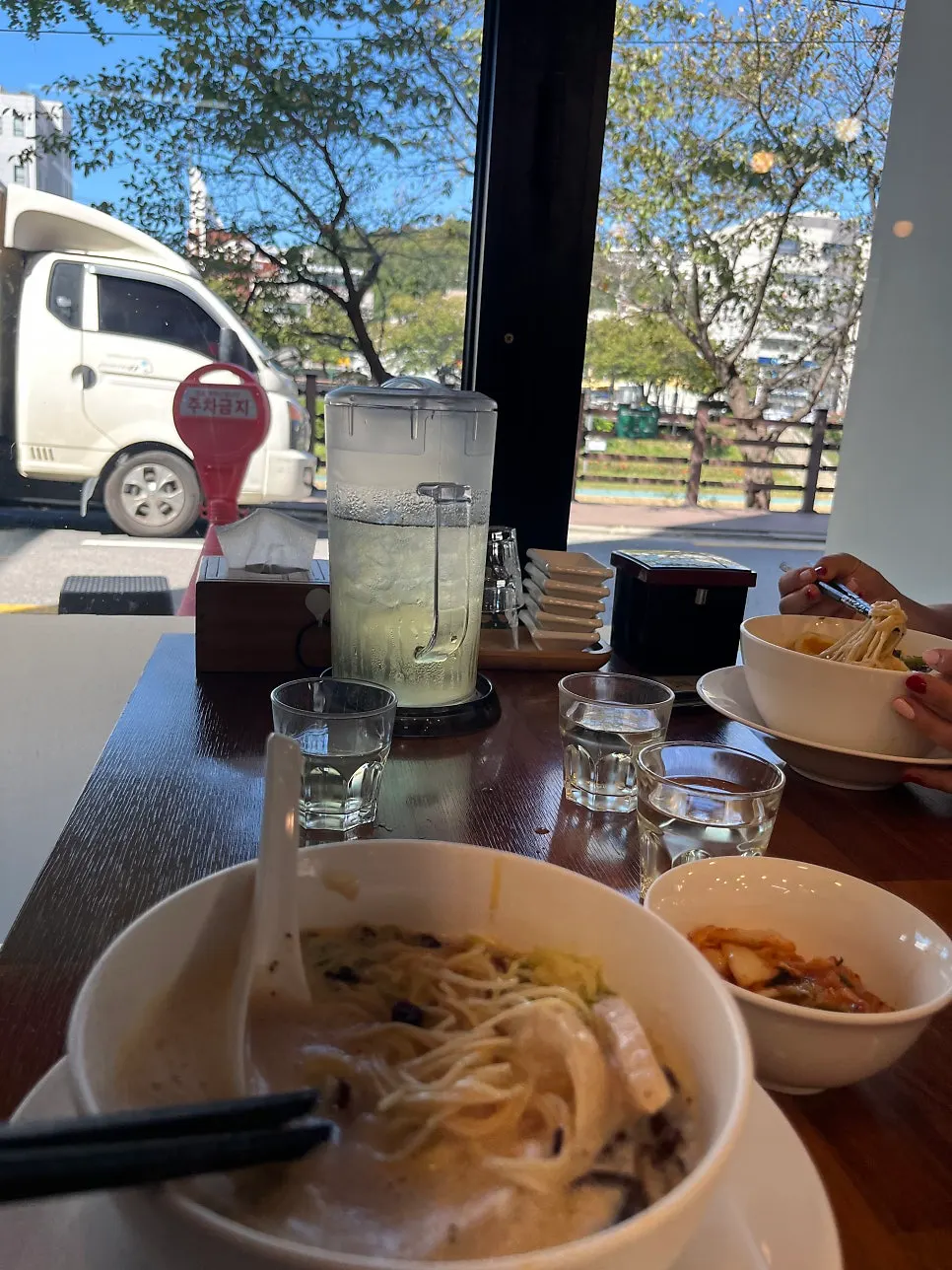 A bowl of ramen topped with kimchi