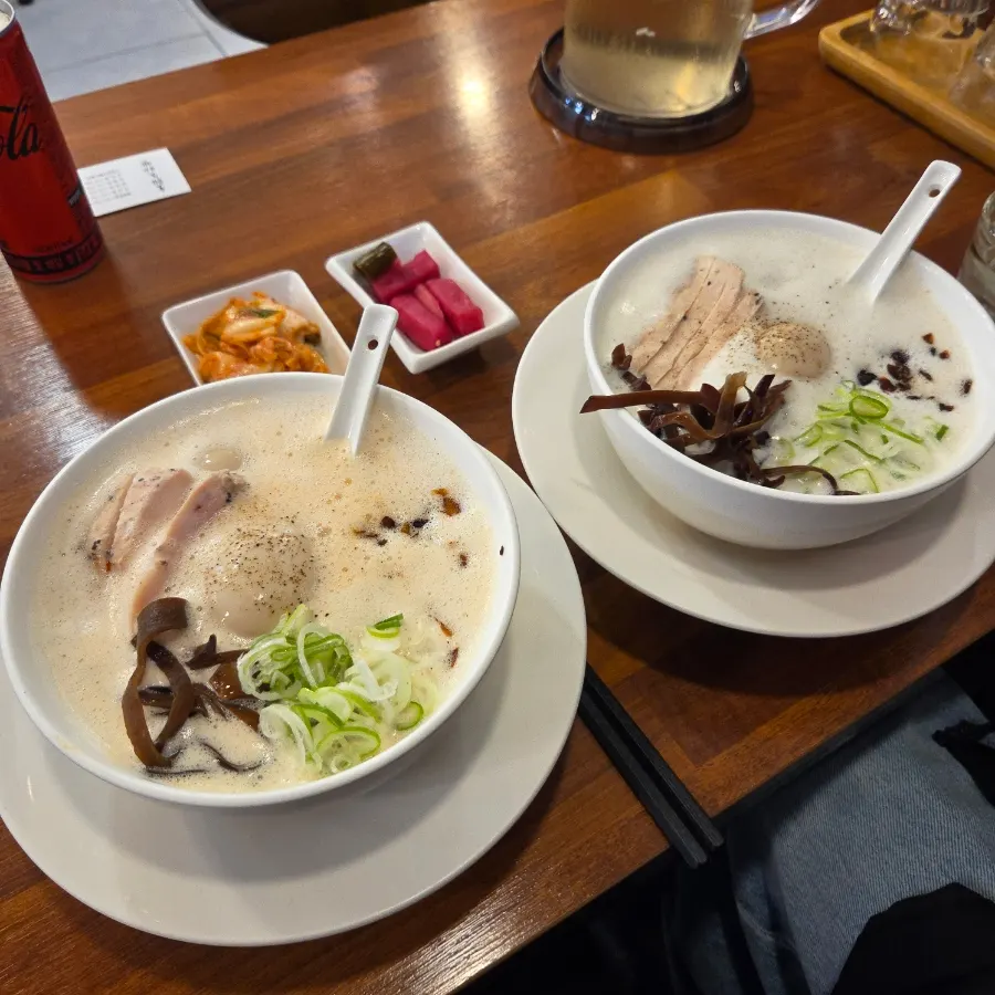 Two bowls of ramen with added eggs