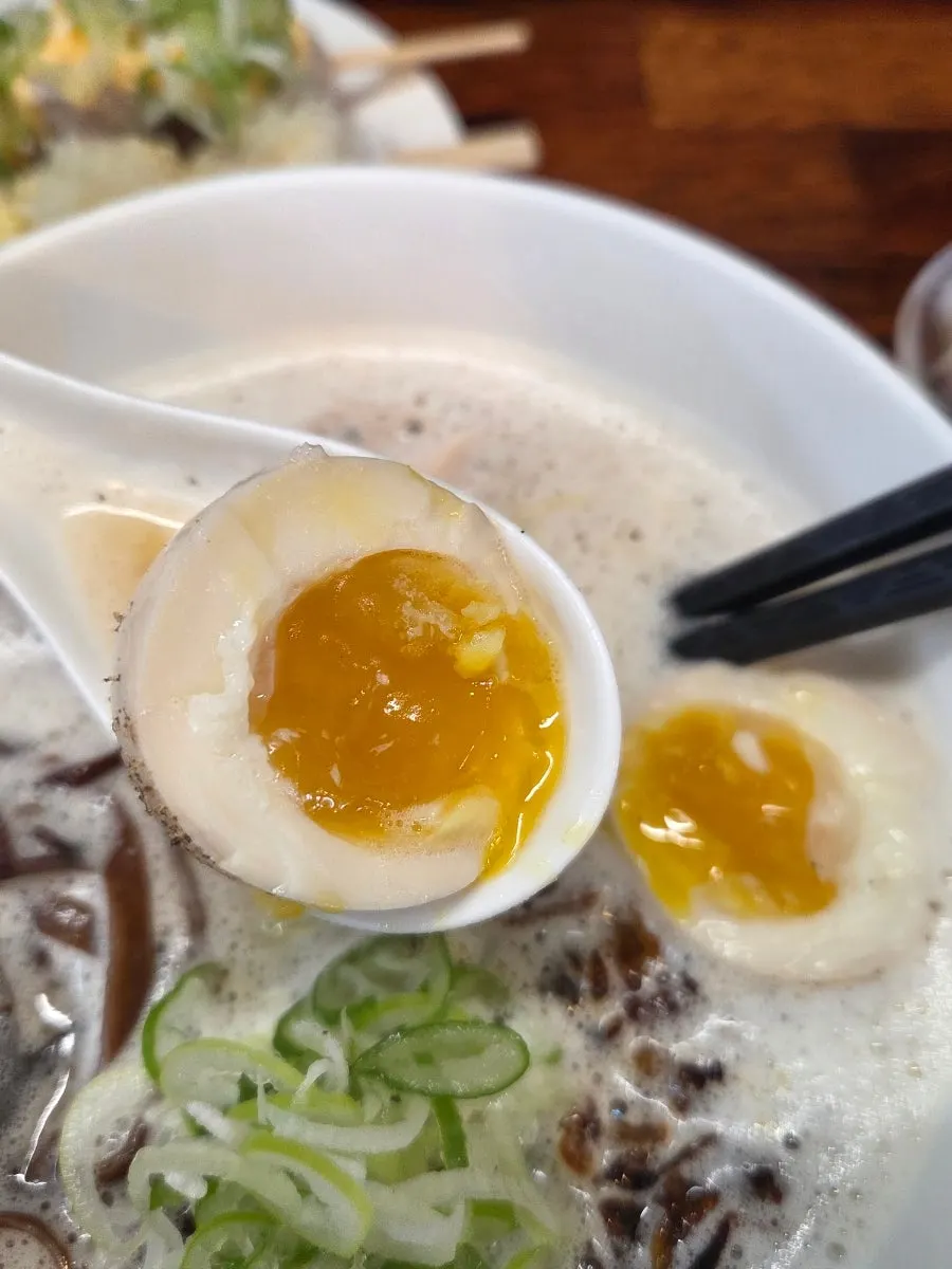 A soft-boiled egg from the tori paitan cut in half