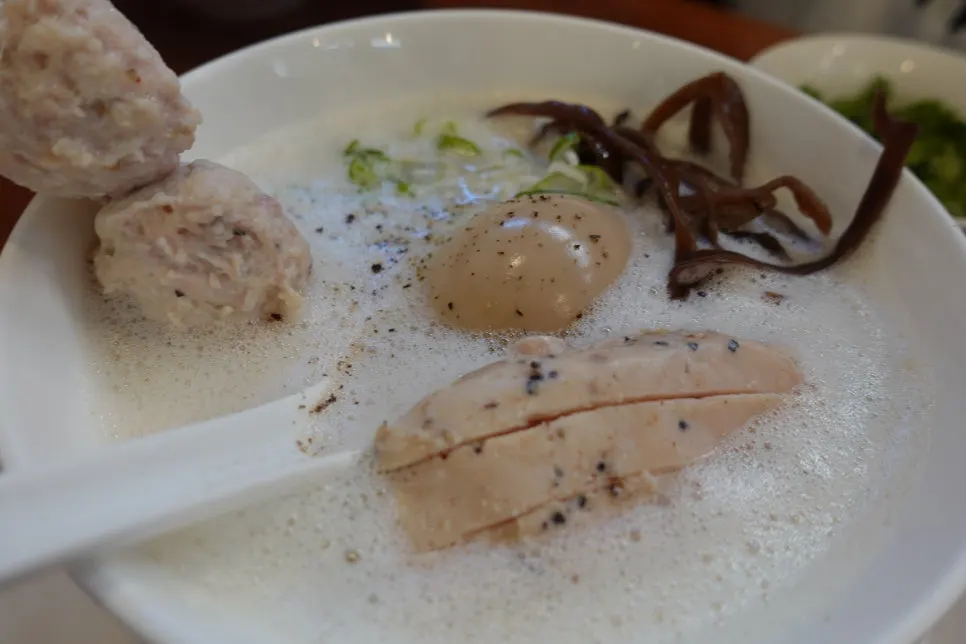 Ramen table setting with a side of kimchi