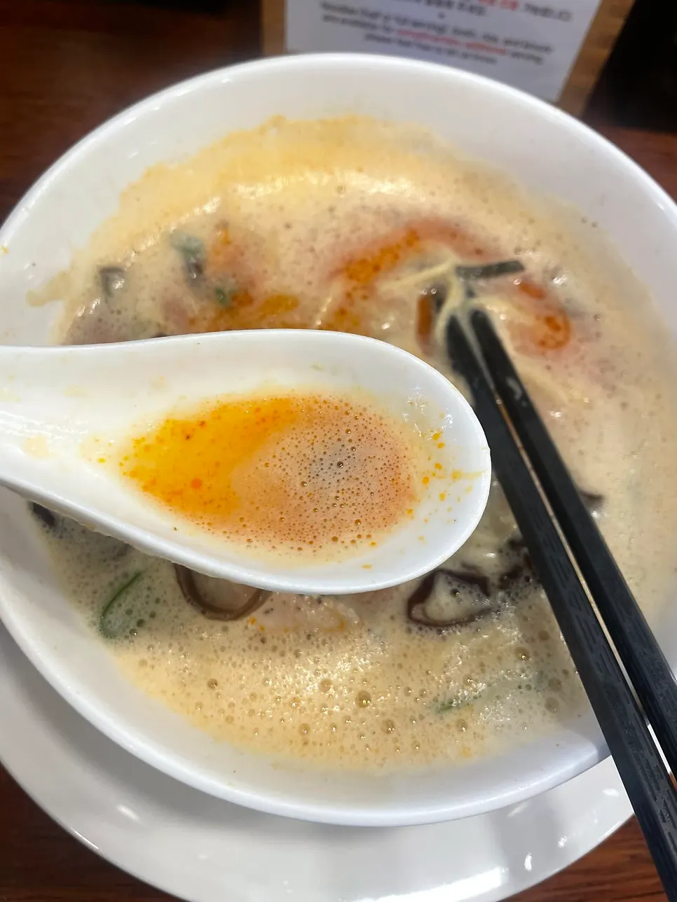 A bowl of tori paitan being eaten